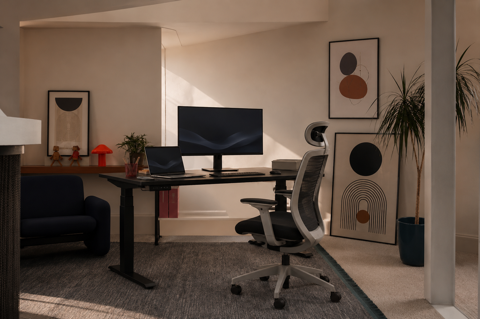 Height-adjustable standing desk raised for productive work in a studio workspace